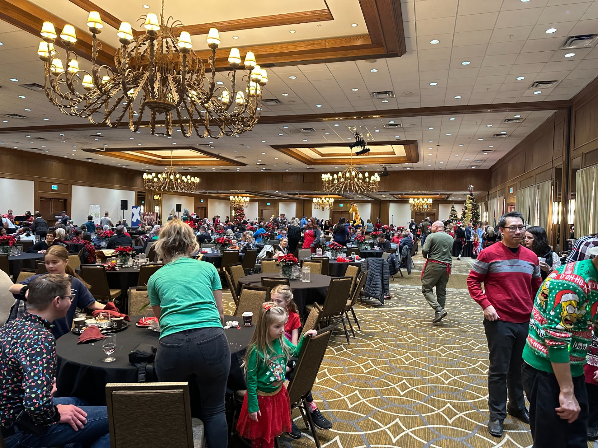 A full banquet hall of families enjoying the Christmas Wish Breakfast